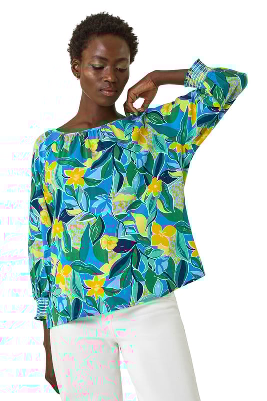 Leaf Print 3/4 Sleeve Top from Roman. Channel tropical vibes with this leaf print top, perfect for the Spring Summer season. The flattering square neckline and 3/4 length sleeves make this tee a must-have in your wardrobe. Crafted from a comfortable woven fabric, it showcases an all-over tropical leaf print for a fresh and stylish look. Dress it up with a denim jacket and jeggings for the ultimate casual outfit!