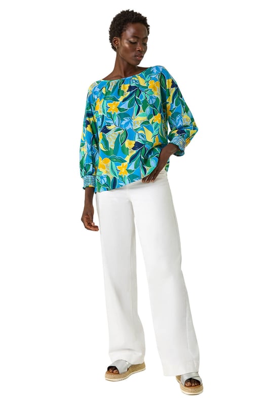 Leaf Print 3/4 Sleeve Top from Roman. Channel tropical vibes with this leaf print top, perfect for the Spring Summer season. The flattering square neckline and 3/4 length sleeves make this tee a must-have in your wardrobe. Crafted from a comfortable woven fabric, it showcases an all-over tropical leaf print for a fresh and stylish look. Dress it up with a denim jacket and jeggings for the ultimate casual outfit!