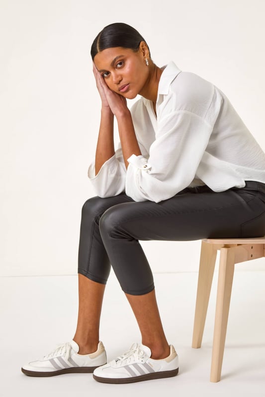 Metallic Coated Crop Jeggings Metallic Coated Crop Jeggings from Roman. Take your style to the next level with these metallic coated crop jeggings. This smart pair is adorned with essential front and back pockets featuring functional belt loops for a practical edge. The jeggings are cut in a fitting shape, crafted from stretch woven fabric for all-day comfort. Perfect for any occasion, pair these jeggings with a blouse for a sophisticated look!