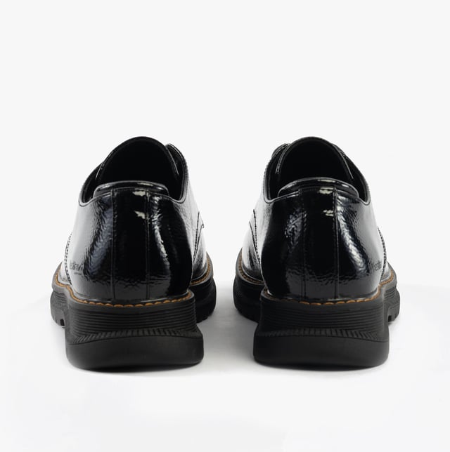These casual women's shoes feature a leather upper, textile lining, rubber sole, and lace-up closure. Designed for comfort and breathability with a low heel and round toe
