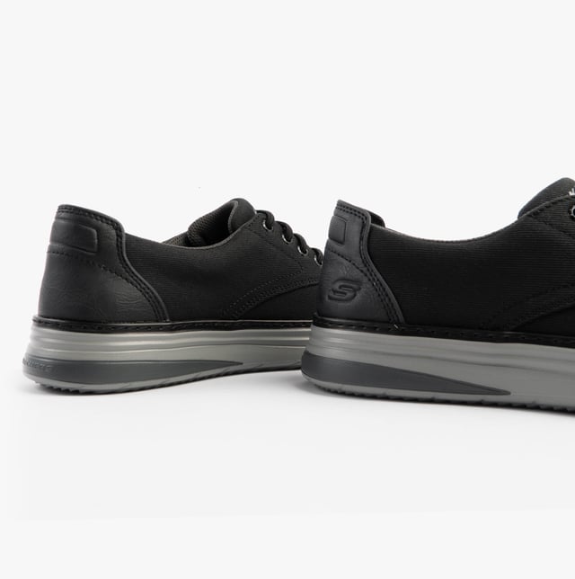 Skechers Hyland - Ratner Mens Shoes Black These casual men's shoes feature a canvas upper, textile lining, rubber sole, and lace-up closure. With air-cooled memory foam and a relaxed fit, they're ideal for everyday comfort