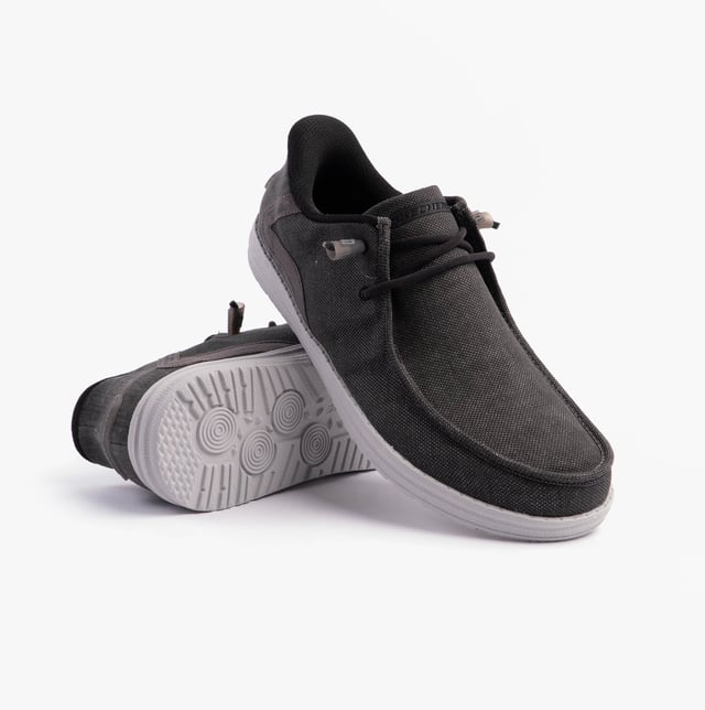 These casual men's shoes feature a canvas upper, textile lining, rubber sole, and slip-in design. They offer comfort with air-cooled memory foam and a relaxed fit for everyday wear