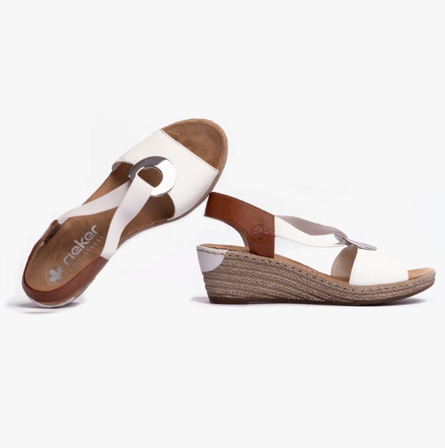 These women's slip-on wedge sandals feature a synthetic upper, breathable textile lining, and a RIRICON sole, offering comfort and a relaxed fit for casual wear