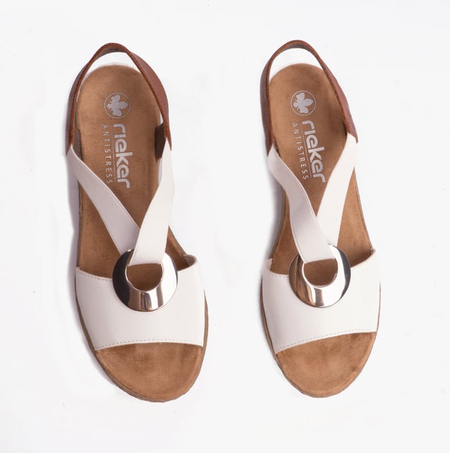 These women's slip-on wedge sandals feature a synthetic upper, breathable textile lining, and a RIRICON sole, offering comfort and a relaxed fit for casual wear