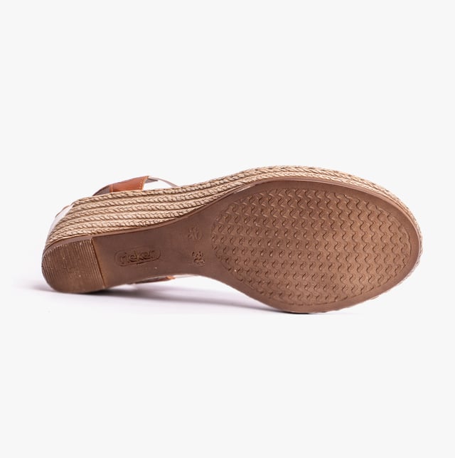 These women's slip-on wedge sandals feature a synthetic upper, breathable textile lining, and a RIRICON sole, offering comfort and a relaxed fit for casual wear