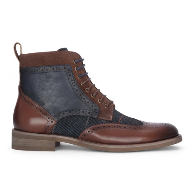 Refine your footwear collection with the Teddy Men's Brown Leather and Navy Tweed Oxford Shoes. Crafted from genuine leather with contrasting navy tweed panels, these shoes offer a perfect blend of traditional style and modern character. The Oxford silhouette provides a smart, structured shape, ideal for formal occasions or smart-casual outfits. A soft inner lining ensures comfort throughout the day, making them as wearable as they are stylish.

Premium Brown Leather Upper for a polished and durable finish

Contrasting Navy Tweed Panels add texture and a unique twist

Classic Oxford Design with a structured silhouette

Lace-Up Fastening ensures a secure and adjustable fit

Soft Inner Lining for comfort during extended wear

Stitched Detailing for added craftsmanship and style

Ideal for Smart-Casual to Formal Events — weddings, work, or evening outings