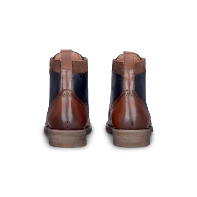 Refine your footwear collection with the Teddy Men's Brown Leather and Navy Tweed Oxford Shoes. Crafted from genuine leather with contrasting navy tweed panels, these shoes offer a perfect blend of traditional style and modern character. The Oxford silhouette provides a smart, structured shape, ideal for formal occasions or smart-casual outfits. A soft inner lining ensures comfort throughout the day, making them as wearable as they are stylish.

Premium Brown Leather Upper for a polished and durable finish

Contrasting Navy Tweed Panels add texture and a unique twist

Classic Oxford Design with a structured silhouette

Lace-Up Fastening ensures a secure and adjustable fit

Soft Inner Lining for comfort during extended wear

Stitched Detailing for added craftsmanship and style

Ideal for Smart-Casual to Formal Events — weddings, work, or evening outings
