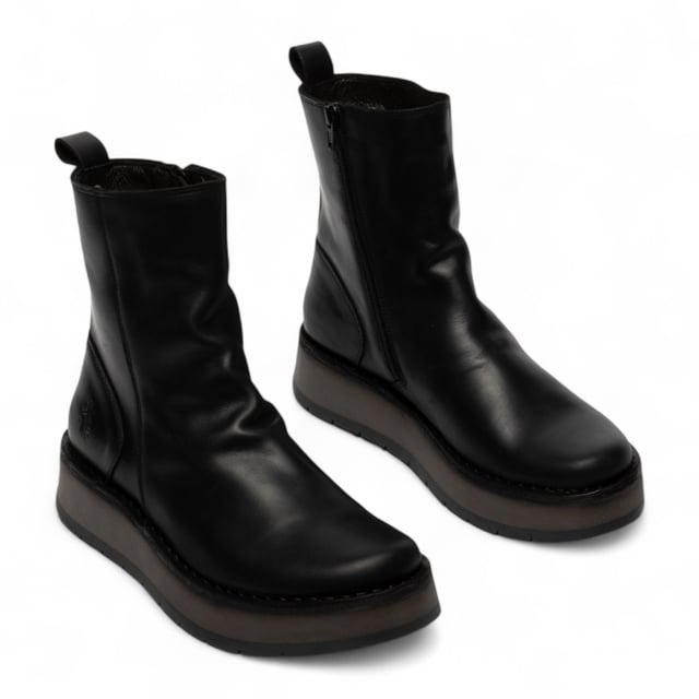 The RENO053FLY from Fly London’s Rawi Line is a sleek and versatile ankle boot crafted from premium leather. Featuring a side zip for easy wear, these boots offer all-day comfort with a soft microfiber lining, cushioned insole, and a stable 3.5 cm wedge heel. Finished with a durable TR rubber sole, they're ideal for both casual and smart-casual outfits.
Upper: Leather
Lining: Microfiber
Insole: Microfiber
Sole: TR Rubber
Heel Height: 3.5 cm
Closure: Zip
Collection: Fly London Women's | Rawi Line
Please note: Natural leather variations such as creases and folds will differ from pair to pair and may not match exactly on both shoes.