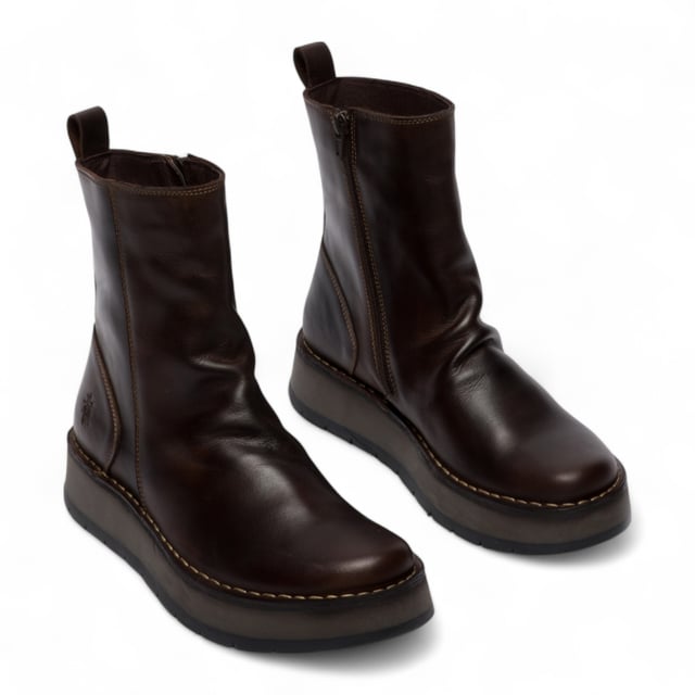 The RENO053FLY from Fly London’s Rawi Line is a sleek and versatile ankle boot crafted from premium leather. Featuring a side zip for easy wear, these boots offer all-day comfort with a soft microfiber lining, cushioned insole, and a stable 3.5 cm wedge heel. Finished with a durable TR rubber sole, they're ideal for both casual and smart-casual outfits.
Upper: Leather
Lining: Microfiber
Insole: Microfiber
Sole: TR Rubber
Heel Height: 3.5 cm
Closure: Zip
Collection: Fly London Women's | Rawi Line
Please note: Natural leather variations such as creases and folds will differ from pair to pair and may not match exactly on both shoes.