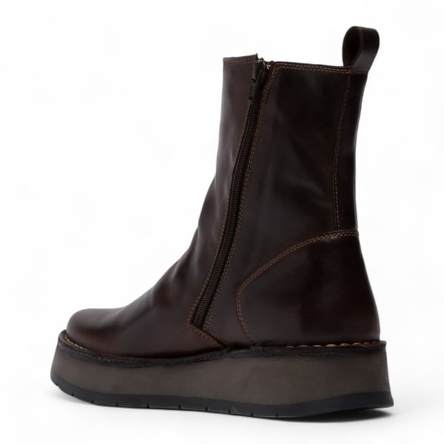 The RENO053FLY from Fly London’s Rawi Line is a sleek and versatile ankle boot crafted from premium leather. Featuring a side zip for easy wear, these boots offer all-day comfort with a soft microfiber lining, cushioned insole, and a stable 3.5 cm wedge heel. Finished with a durable TR rubber sole, they're ideal for both casual and smart-casual outfits.
Upper: Leather
Lining: Microfiber
Insole: Microfiber
Sole: TR Rubber
Heel Height: 3.5 cm
Closure: Zip
Collection: Fly London Women's | Rawi Line
Please note: Natural leather variations such as creases and folds will differ from pair to pair and may not match exactly on both shoes.