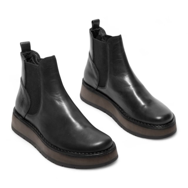 The Fly London RAWI131 Chelsea boots from the Rawi Line blend timeless style with modern comfort. Designed for effortless everyday wear, these ankle boots feature a convenient pull-on design with elasticated side panels. Crafted from premium leather, they offer a soft microfiber lining and cushioned microfiber insole for lasting comfort. The durable TR rubber sole provides reliable grip and support, while the 3.5 cm heel adds a subtle lift without compromising stability. Perfect for both casual and smart-casual looks, these Chelsea boots are a versatile wardrobe essential.

Upper: Leather
Lining: Microfiber
Insole: Microfiber
Sole: TR Rubber
Heel Height: 3.5 cm
Style: Pull-on Chelsea