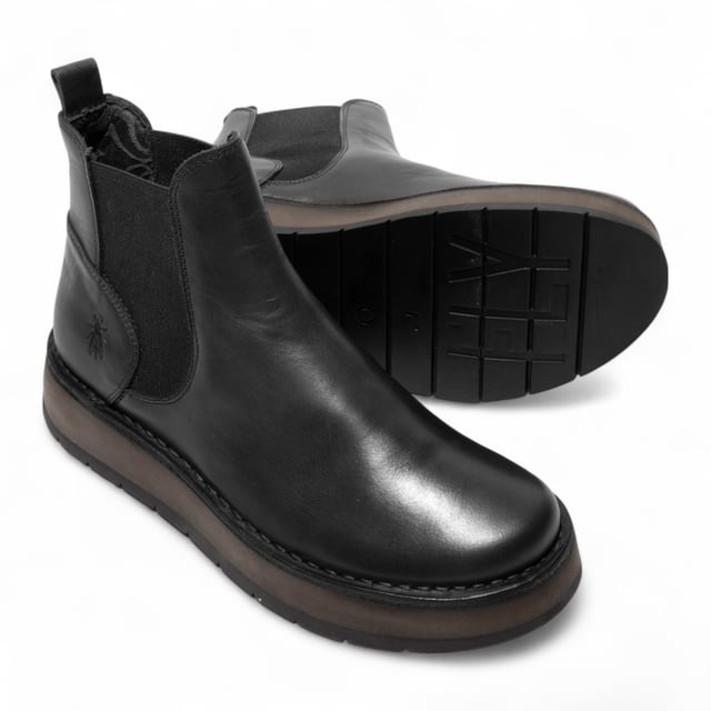 The Fly London RAWI131 Chelsea boots from the Rawi Line blend timeless style with modern comfort. Designed for effortless everyday wear, these ankle boots feature a convenient pull-on design with elasticated side panels. Crafted from premium leather, they offer a soft microfiber lining and cushioned microfiber insole for lasting comfort. The durable TR rubber sole provides reliable grip and support, while the 3.5 cm heel adds a subtle lift without compromising stability. Perfect for both casual and smart-casual looks, these Chelsea boots are a versatile wardrobe essential.

Upper: Leather
Lining: Microfiber
Insole: Microfiber
Sole: TR Rubber
Heel Height: 3.5 cm
Style: Pull-on Chelsea