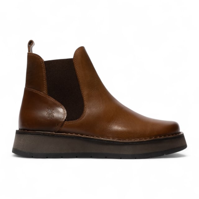 The Fly London RAWI131 Chelsea boots from the Rawi Line blend timeless style with modern comfort. Designed for effortless everyday wear, these ankle boots feature a convenient pull-on design with elasticated side panels. Crafted from premium leather, they offer a soft microfiber lining and cushioned microfiber insole for lasting comfort. The durable TR rubber sole provides reliable grip and support, while the 3.5 cm heel adds a subtle lift without compromising stability. Perfect for both casual and smart-casual looks, these Chelsea boots are a versatile wardrobe essential.

Upper: Leather
Lining: Microfiber
Insole: Microfiber
Sole: TR Rubber
Heel Height: 3.5 cm
Style: Pull-on Chelsea