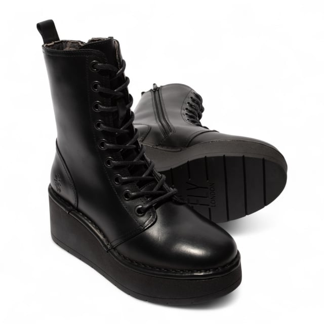 Add bold comfort to your wardrobe with the Fly London HAIT273 ankle boots. Crafted from premium leather and lined with soft microfiber, these lace-up boots are built for everyday wear with a fashion-forward edge. A side zip makes slipping them on easy, while the foam-padded footbed offers cushioned support. Set on a chunky 3-inch rubber wedge platform, they deliver excellent grip, traction, and elevation without sacrificing comfort.

Upper: Premium Leather
Lining: Microfiber
Insole: Foam-padded, microfiber-lined
Sole: Durable Rubber platform
Closure: Lace-up with side zip
Heel Height: 3 inches (approx. 7.6 cm)
Style: Chunky platform ankle boots
Features: Cushioned footbed, great grip & traction, ideal for all-day wear