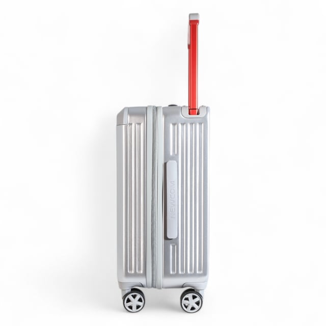 Upgrade your journey with this striking Hard Case Cabin Luggage, combining a sleek, ridged silver exterior with a vibrant red telescopic handle for both style and robust durability, ensuring you're always ready for your next short trip or quick getaway.

Key Features:

Durable Hard Case: Built to withstand the rigors of travel, offering superior protection for your belongings.
Effortless Mobility: Equipped with 360° spinner wheels for smooth, multi-directional gliding through airports and beyond.
Ergonomic Red Handle: A sturdy, adjustable telescopic handle provides a comfortable grip and adds a pop of color.
Integrated Cup Holder: Conveniently designed with a built-in cup holder for easy access to your beverage on the go.
Side Bag Hook: Features an integrated hook for securely carrying shopping bags or other personal items.
Stylish Design: Features a distinctive silver ribbed finish for a modern and sophisticated look.
Travel with confidence and style — this cabin luggage is your reliable companion for any destination.

Size and Specification:
Cabin:
Dimensions: 38 x 24 x 56.5 CM
Weight: 3.17 kg
Capacity: 42.03 L