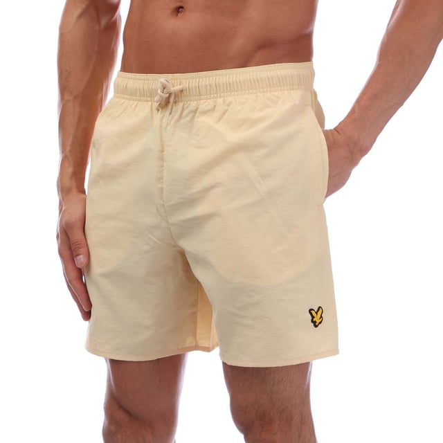 Mens Lyle And Scott Sports Swim Shorts in sand.- Elasticated waistband.- Side slip pockets.- Back flap pocket.- Rubberised logo.- Breathable  lightweight fabric.- Body: 100% Polyamide. Lining: 100% Polyester.- Ref: SH1266SPBX183