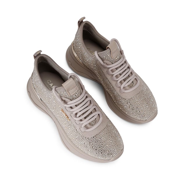 This Carvela Swift Jewel Runner trainer features a taupe fabric upper with gold crystal embellishment. The front laces up with gold tone branding on the eye stay.