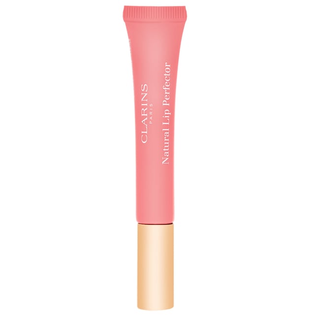 Experience the ultimate in lip care with Clarins Instant Light Natural Lip Perfector in 05 Candy Shimmer. This sweetly scented lip gel delivers a silky smooth texture that enhances your lips with a beautiful shimmer and fullness. Its sheer, radiant colors can be worn alone for a natural look or layered over your favorite lipstick for added depth and shine. Perfect for daily wear, this lip perfector is a must-have addition to your beauty routine, providing hydration and a luscious finish.