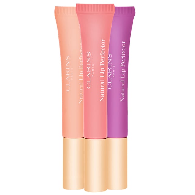 Experience the ultimate in lip care with Clarins Instant Light Natural Lip Perfector in 05 Candy Shimmer. This sweetly scented lip gel delivers a silky smooth texture that enhances your lips with a beautiful shimmer and fullness. Its sheer, radiant colors can be worn alone for a natural look or layered over your favorite lipstick for added depth and shine. Perfect for daily wear, this lip perfector is a must-have addition to your beauty routine, providing hydration and a luscious finish.