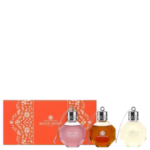 Indulge in the Molton Brown Festive Bath & Shower Gel Bauble Gift Set, featuring three luxurious 75ml shower gels: Fiery Pink Pepper, Re-charge Black Pepper, and Delicious Rhubarb & Rose. Each gel offers a unique aromatic experience: Fiery Pink Pepper invigorates with its spicy notes, while Re-charge Black Pepper energizes with a refreshing blend of citrus and spices. Delicious Rhubarb & Rose leaves your skin delicately scented with a harmonious mix of fruity and floral notes. Perfect for gifting, this cruelty-free set is sure to delight anyone seeking a premium shower experience.