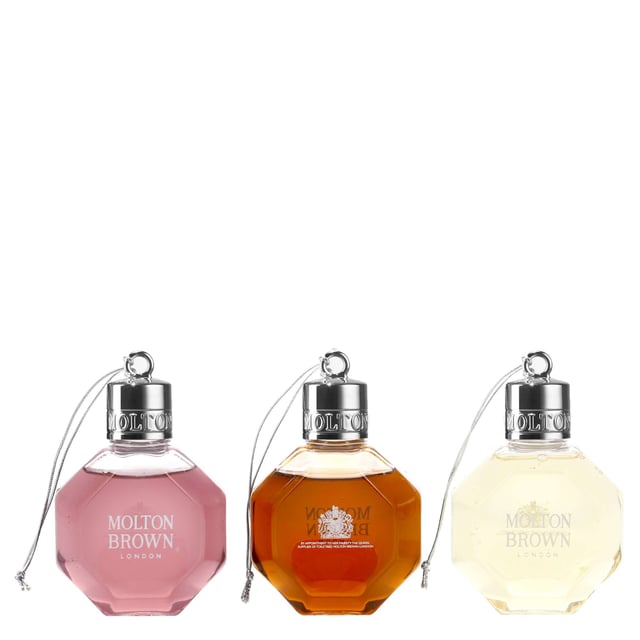 Indulge in the Molton Brown Festive Bath & Shower Gel Bauble Gift Set, featuring three luxurious 75ml shower gels: Fiery Pink Pepper, Re-charge Black Pepper, and Delicious Rhubarb & Rose. Each gel offers a unique aromatic experience: Fiery Pink Pepper invigorates with its spicy notes, while Re-charge Black Pepper energizes with a refreshing blend of citrus and spices. Delicious Rhubarb & Rose leaves your skin delicately scented with a harmonious mix of fruity and floral notes. Perfect for gifting, this cruelty-free set is sure to delight anyone seeking a premium shower experience.