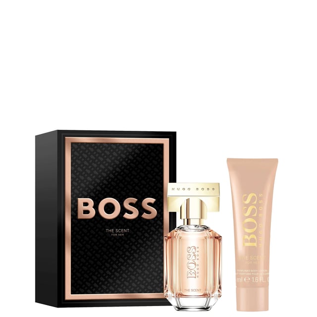 Celebrate the essence of femininity this holiday season with the HUGO BOSS The Scent For Her Eau de Parfum gift set. Nestled in a luxurious black box adorned with rose-gold accents, this gift set embodies sophistication and charm. The fragrance opens with delightful top notes of honeyed peach and freesia, leading into a heart of exotic Osmanthus flower that adds warmth and depth. The journey concludes with a rich base of roasted cocoa, delivering an alluring, unforgettable scent. This set includes a 30ml Eau de Parfum and a 50ml Body Lotion, making it the perfect gift for someone special.