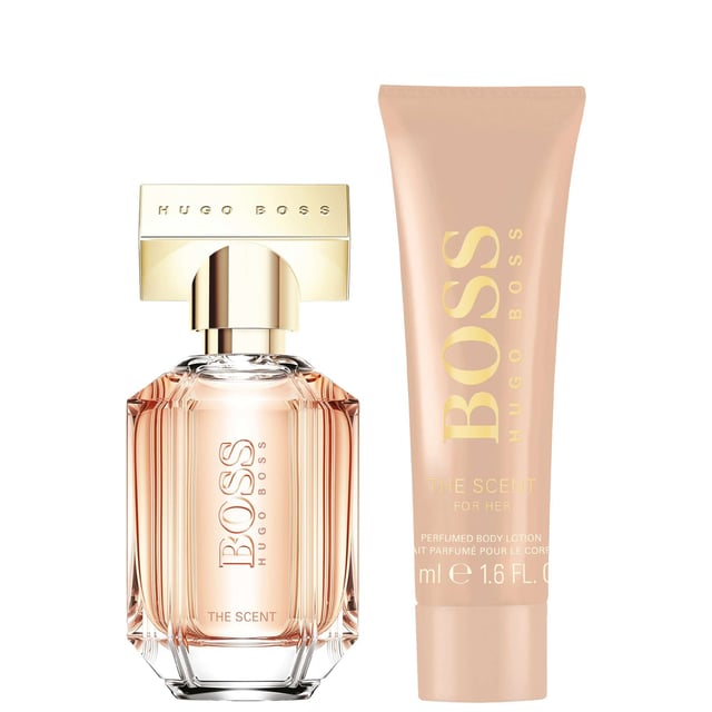 Celebrate the essence of femininity this holiday season with the HUGO BOSS The Scent For Her Eau de Parfum gift set. Nestled in a luxurious black box adorned with rose-gold accents, this gift set embodies sophistication and charm. The fragrance opens with delightful top notes of honeyed peach and freesia, leading into a heart of exotic Osmanthus flower that adds warmth and depth. The journey concludes with a rich base of roasted cocoa, delivering an alluring, unforgettable scent. This set includes a 30ml Eau de Parfum and a 50ml Body Lotion, making it the perfect gift for someone special.