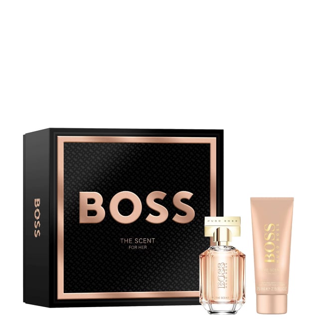 Celebrate femininity with the HUGO BOSS The Scent For Her Eau de Parfum Gift Set. Elegantly presented in a luxurious black box with rose-gold accents, this exquisite gift set is perfect for holidays and special occasions. The fragrance opens with honeyed peach and delicate freesia, leading to a heart of rich Osmanthus flower, and concludes with a base of roasted cocoa for an unforgettable experience. This set includes a 50ml Eau de Parfum and a 75ml body lotion, making it a perfect gift for yourself or a loved one.