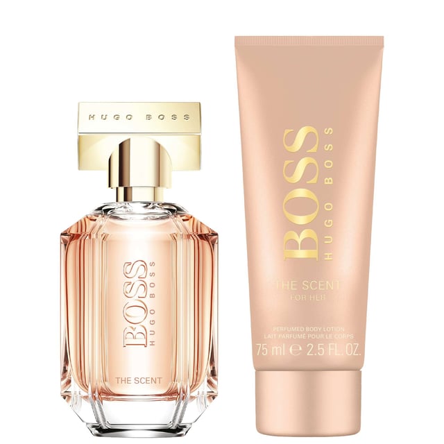 Celebrate femininity with the HUGO BOSS The Scent For Her Eau de Parfum Gift Set. Elegantly presented in a luxurious black box with rose-gold accents, this exquisite gift set is perfect for holidays and special occasions. The fragrance opens with honeyed peach and delicate freesia, leading to a heart of rich Osmanthus flower, and concludes with a base of roasted cocoa for an unforgettable experience. This set includes a 50ml Eau de Parfum and a 75ml body lotion, making it a perfect gift for yourself or a loved one.