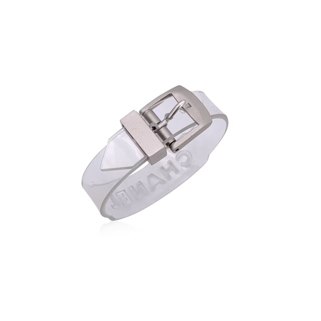 VINTAGE, RRP AS NEW
Add a playful twist of luxury to your collection with this lovely CHANEL bracelet, a rare and striking piece that fuses bold branding with unexpected materials. Crafted in clear transparent rubber, it's a standout example of late '90s CHANEL design-where classic elegance met avant-garde edge.  The bracelet features cut-out CHANEL lettering that runs boldly across its surface, allowing light to pass through for a modern, sculptural look. A buckle closure adds an industrial-chic touch, keeping the fit secure and adjustable.  Stamped with the 'Chanel 99 CC S Made in France' hallmark near the closure, this piece dates to 1999, offering collectors a glimpse into one of the brand's more experimental eras. At 8.25 inches (21 cm) in total length, it's designed to fit comfortably on most wrists.  Whether worn solo as a statement or layered with fine bangles for contrast, this bracelet is a perfect blend of vintage charm and futuristic flair-unmistakably CHANEL, and effortlessly cool. Condition Rating: A - EXCELLENTCondition Details: Minimal wear of use on rubber. Please, look carefully at the photos and ask for any detail.  Box?: ?: No Measurments:  length: 210 mm