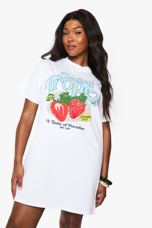 Oversized T-shirt dress featuring a vibrant Saint Tropez strawberry graphic print
        Relaxed crew neckline and short sleeves for effortless comfort
        Cotton fabric offers breathable wear perfect for warmer days
        Versatile mini length ideal for casual styling
        Plus size design with a roomy, comfortable fit
    
    This playful Saint Tropez graphic T-shirt dress from Boohoo brings carefree holiday vibes to your everyday wardrobe. The oversized silhouette creates a relaxed look that's both comfortable and on-trend. Style it as seen with ankle boots and a woven tote for farmers' markets and weekend brunches, or pair with trainers and a denim jacket for casual coffee dates. For festival season, add chunky jewellery and wellies for an effortlessly cool ensemble. The versatile design works brilliantly with leggings underneath during transitional weather, while the cotton composition ensures all-day comfort. This T-shirt dress embodies the laid-back aesthetic that's perfect for casual gatherings and daytime outings when you want to combine comfort with personality.