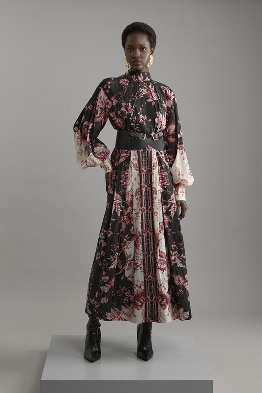 Silk Cotton Border Print Floral Woven Maxi Dress Step out in confidence in our long sleeve dress, which is made with slinky silk, and features a relaxed fit and long, balloon style sleeves. The bold, floral print adds a feminine touch ideal for any occasion, and the bow behind the neck elevates it even further. This dress can easily be paired with boots or heels for a day to night look. Silk Cotton Border Print Floral Woven Maxi Dress High Quality, Smooth Silk Fabric Comfortable, Relaxed Silhouette High Neckline Vibrant Floral Print Long Balloon Sleeves Bow Accent in Back