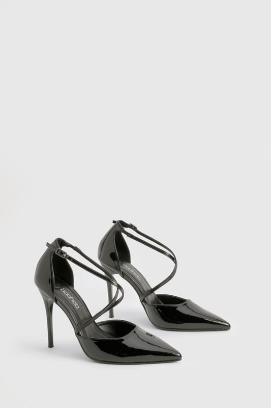 Striking cross-strap design adds contemporary flair to these pointed-toe court shoes
        High 7-9cm stiletto heel creates a leg-lengthening effect
        Glossy finish catches the light for added drama
        Pointed toe silhouette offers a timeless, sophisticated profile
        Adjustable ankle strap with buckle fastening ensures a secure fit
    
    These cross-strap court shoes are the perfect blend of modern design and classic elegance. The distinctive strappy detail creates visual interest while maintaining a sleek silhouette that works beautifully for various occasions. Style them with tailored trousers and a crisp blouse for office sophistication, or pair with your favourite little black dress for evening events. The pointed toe and high heel create a flattering line that elongates your legs, whilst the secure cross-straps provide stability without sacrificing style. These versatile heels transition effortlessly from day to night, making them an essential addition to your footwear collection. For weekend glamour, team with straight-leg jeans and a statement top to showcase their eye-catching design. A true wardrobe hero that delivers both comfort and head-turning style.
