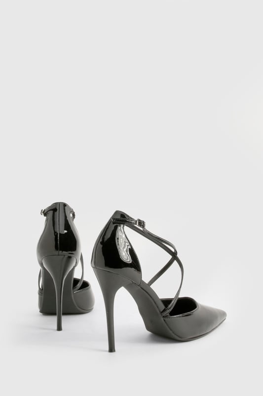 Striking cross-strap design adds contemporary flair to these pointed-toe court shoes
        High 7-9cm stiletto heel creates a leg-lengthening effect
        Glossy finish catches the light for added drama
        Pointed toe silhouette offers a timeless, sophisticated profile
        Adjustable ankle strap with buckle fastening ensures a secure fit
    
    These cross-strap court shoes are the perfect blend of modern design and classic elegance. The distinctive strappy detail creates visual interest while maintaining a sleek silhouette that works beautifully for various occasions. Style them with tailored trousers and a crisp blouse for office sophistication, or pair with your favourite little black dress for evening events. The pointed toe and high heel create a flattering line that elongates your legs, whilst the secure cross-straps provide stability without sacrificing style. These versatile heels transition effortlessly from day to night, making them an essential addition to your footwear collection. For weekend glamour, team with straight-leg jeans and a statement top to showcase their eye-catching design. A true wardrobe hero that delivers both comfort and head-turning style.