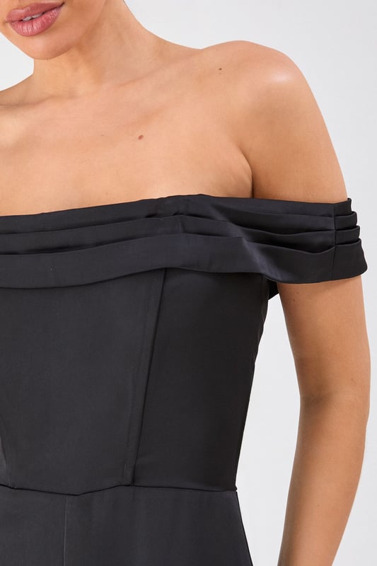 Elegant Bardot neckline with sophisticated folded detail for a striking off-shoulder silhouette
        Luxurious satin fabric that catches the light beautifully as you move
        Flattering structured bodice that enhances your natural shape
        Dramatic wide leg design offering both comfort and statement style
        Floor-sweeping length perfect for creating a statuesque appearance
    
    Command attention at your next special occasion in this show-stopping Misspap jumpsuit. The striking Bardot neckline frames your dcolletage whilst the structured bodice creates a flattering silhouette that transitions into flowing wide legs for dramatic effect. Style with statement earrings and sleek heels as seen on our model for maximum impact at formal events. This versatile piece works brilliantly for weddings, graduation ceremonies or evening soires - simply switch up your accessories to suit the occasion. For cooler evenings, layer with a tailored blazer or delicate wrap without compromising on glamour. The all-in-one design offers effortless sophistication whilst ensuring you stand out from the crowd.