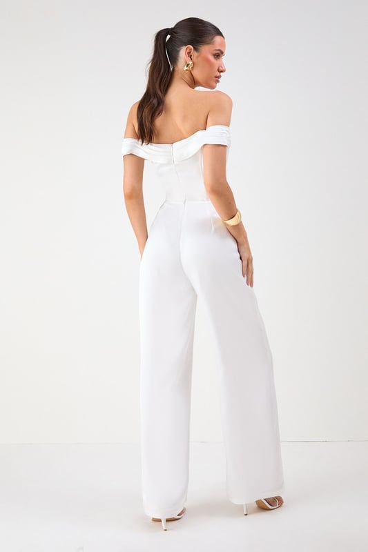 Elegant Bardot neckline with sophisticated folded detail for a striking off-shoulder silhouette
        Luxurious satin fabric that catches the light beautifully as you move
        Flattering structured bodice that enhances your natural shape
        Dramatic wide leg design offering both comfort and statement style
        Floor-sweeping length perfect for creating a statuesque appearance
    
    Command attention at your next special occasion in this show-stopping Misspap jumpsuit. The striking Bardot neckline frames your dcolletage whilst the structured bodice creates a flattering silhouette that transitions into flowing wide legs for dramatic effect. Style with statement earrings and sleek heels as seen on our model for maximum impact at formal events. This versatile piece works brilliantly for weddings, graduation ceremonies or evening soires - simply switch up your accessories to suit the occasion. For cooler evenings, layer with a tailored blazer or delicate wrap without compromising on glamour. The all-in-one design offers effortless sophistication whilst ensuring you stand out from the crowd.