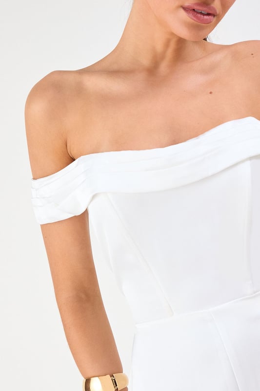 Elegant Bardot neckline with sophisticated folded detail for a striking off-shoulder silhouette
        Luxurious satin fabric that catches the light beautifully as you move
        Flattering structured bodice that enhances your natural shape
        Dramatic wide leg design offering both comfort and statement style
        Floor-sweeping length perfect for creating a statuesque appearance
    
    Command attention at your next special occasion in this show-stopping Misspap jumpsuit. The striking Bardot neckline frames your dcolletage whilst the structured bodice creates a flattering silhouette that transitions into flowing wide legs for dramatic effect. Style with statement earrings and sleek heels as seen on our model for maximum impact at formal events. This versatile piece works brilliantly for weddings, graduation ceremonies or evening soires - simply switch up your accessories to suit the occasion. For cooler evenings, layer with a tailored blazer or delicate wrap without compromising on glamour. The all-in-one design offers effortless sophistication whilst ensuring you stand out from the crowd.