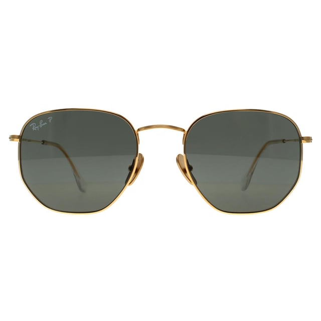 Ray-Ban Square Unisex Polished Gold Green G-15 Polarized Hexagonal Titanium RB8148  Sunglasses offer a bold, modern twist on the classic geometric shape, combining sharp, hexagonal lenses with a lightweight titanium frame for a sleek, durable design. Known for their strength and corrosion resistance, the titanium frame ensures a comfortable fit without sacrificing style. The sunglasses provide excellent UV protection, while the unique shape adds a distinct edge to any look. With a minimalist yet sophisticated aesthetic, the RB8148 sunglasses are perfect for those seeking a refined, fashion-forward accessory that stands out in both urban and outdoor settings.