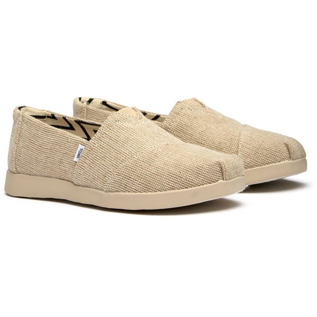 Effortlessly chic and wonderfully comfortable, these canvas espadrilles bring laid-back sophistication to any wardrobe. The natural tone pairs beautifully with everything from flowing sundresses to cropped denim, while the durable rubber sole provides reliable traction for all your adventures. Classic TOMS styling meets enhanced comfort in this elevated take on the beloved Alpargata silhouette.