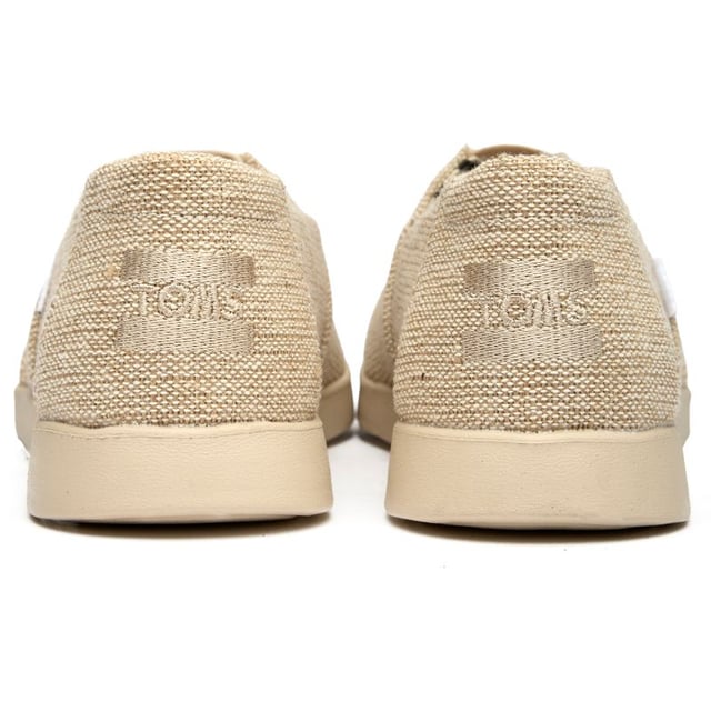 Effortlessly chic and wonderfully comfortable, these canvas espadrilles bring laid-back sophistication to any wardrobe. The natural tone pairs beautifully with everything from flowing sundresses to cropped denim, while the durable rubber sole provides reliable traction for all your adventures. Classic TOMS styling meets enhanced comfort in this elevated take on the beloved Alpargata silhouette.