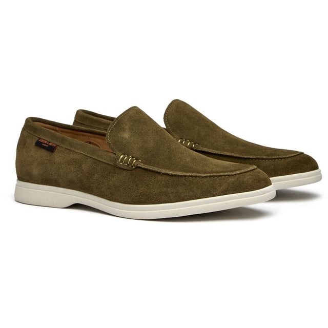 The Simon Carter Tanius Slip On brings style to contemporary menswear with its rich green suede construction and dinosaur print lining. These premium loafers feature luxurious leather sock and lining for all-day comfort, while the durable rubber sole ensures reliable traction. Complete with an exclusive branded shoe bag, they're perfect for the modern gentleman who appreciates distinctive details and museum-quality craftsmanship.