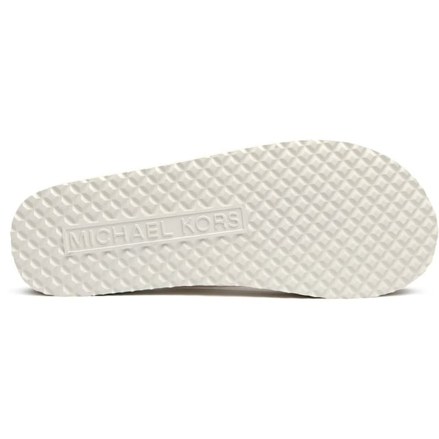 The Michael Kors Zaza brings effortless sophistication to your summer wardrobe with its sleek natural colorway and signature chain-effect straps. These versatile slides transition seamlessly from poolside lounging to casual city strolls, while the durable PVC upper and rubber sole ensure lasting comfort. The understated MK branding adds that perfect touch of luxury to your everyday essentials.