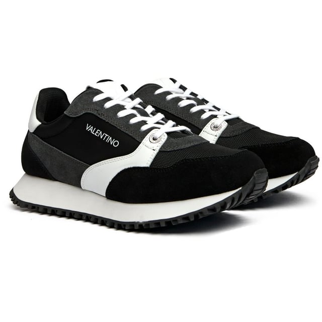 The Valentino Dred elevates athletic-inspired style with luxurious Italian craftsmanship. These sleek black trainers feature premium suede uppers paired with a responsive EVA sole for all-day comfort. Signature Valentino branding adds an unmistakable designer edge to the running-inspired silhouette. Complete with a branded shoe bag, they're the perfect fusion of high fashion and street-ready functionality.
