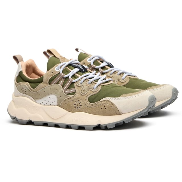 Discover the Flower Mountain Yamano 3, a distinctive running-inspired trainer that blends functionality with natural elements. The lush green colorway showcases premium suede and nylon construction, while leather lining offers superior comfort against your feet. Natural cork antibacterial insoles provide a fresh feel all day long. Thoughtful details like nylon pull tabs and the signature branded leather patch elevate these lightweight trainers, supported by a responsive EVA midsole and durable rubber outsole.