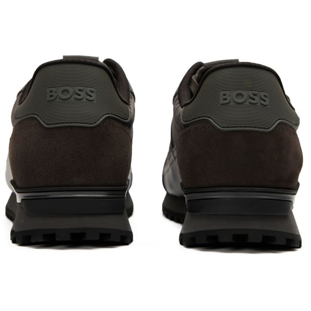 Boss Parkour Trainers The Boss Parkour combines urban style with running-inspired design in a sleek dark grey and black silhouette. Crafted with premium nylon uppers offering a luxurious finish while maintaining breathability, these men's trainers deliver exceptional comfort for daily wear. The lightweight EVA rubber outsole provides reliable traction and long-lasting durability without weighing you down. Perfect for casual outings or active days, BOSS delivers their signature refined aesthetic in a performance-ready package.