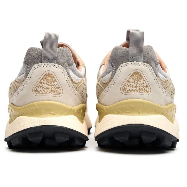 The Flower Mountain Yamano 3 Uni trainers blend outdoor inspiration with contemporary design. Crafted with premium nylon and suede uppers, these natural-toned running-style shoes deliver both durability and style. The distinctive branded leather patch adds character, while cork antibacterial insoles provide natural freshness. Practical touches include convenient pull tabs and a lightweight EVA midsole/rubber sole combination that ensures all-day comfort. Perfect for the urban explorer who values Japanese-inspired quality craftsmanship and understated aesthetics.