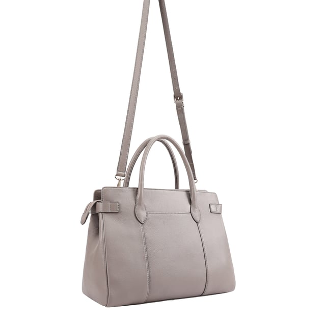 Crafted from soft premium leather, this elegant work bag combines style with functionality. Its spacious central compartment is smartly organized with slip and zipped pockets on both internal walls, while a padded section keeps your gadget safe. A top zip secures the contents, and a handy back slip pocket adds extra convenience. Carry it your way with the removable, adjustable shoulder strap, and enjoy the added touch of sophistication with a branded luggage tag accessory.