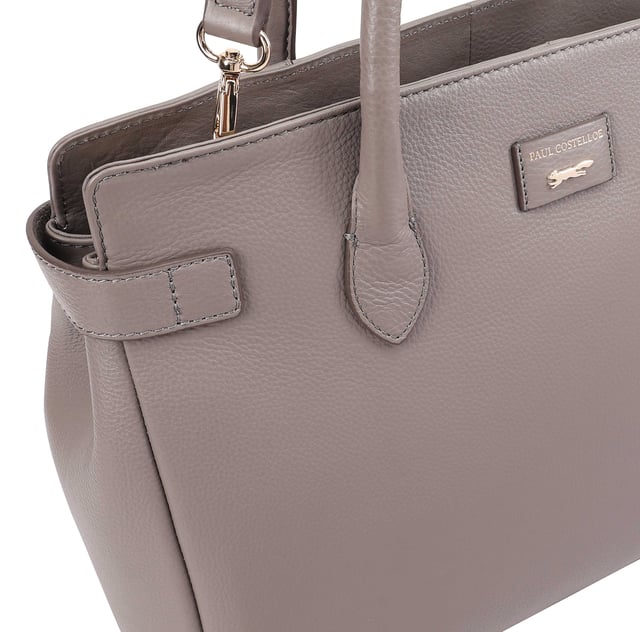 Crafted from soft premium leather, this elegant work bag combines style with functionality. Its spacious central compartment is smartly organized with slip and zipped pockets on both internal walls, while a padded section keeps your gadget safe. A top zip secures the contents, and a handy back slip pocket adds extra convenience. Carry it your way with the removable, adjustable shoulder strap, and enjoy the added touch of sophistication with a branded luggage tag accessory.