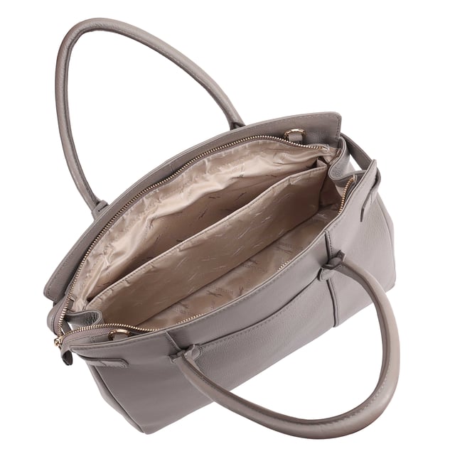 Crafted from soft premium leather, this elegant work bag combines style with functionality. Its spacious central compartment is smartly organized with slip and zipped pockets on both internal walls, while a padded section keeps your gadget safe. A top zip secures the contents, and a handy back slip pocket adds extra convenience. Carry it your way with the removable, adjustable shoulder strap, and enjoy the added touch of sophistication with a branded luggage tag accessory.