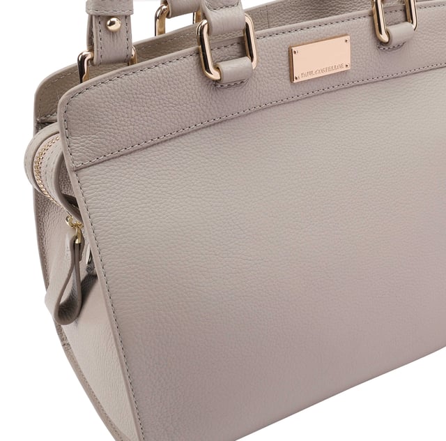 Discover the perfect blend of style and functionality with our Elegant Leather Grab Bag. Made from luxurious, soft grainy leather, this bag is designed for daily use. The spacious interior keeps your essentials organized, featuring zip and slip pockets for convenience. The secure top zip closure ensures your belongings stay safe. With its sleek design and subtle brand logo, this grab bag is ideal for any occasion. The adjustable shoulder strap offers versatile carrying options, making it a must-have accessory.